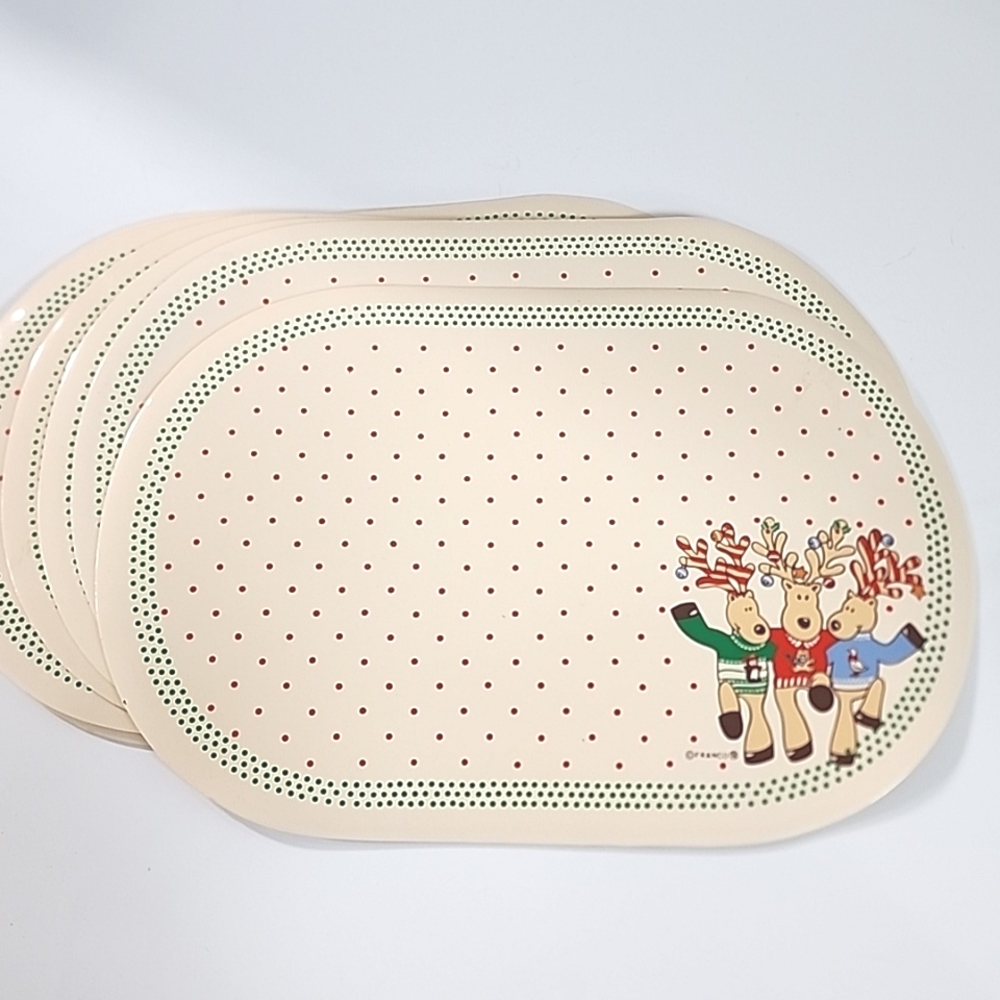 Set of 8 vintage 80s Christmas vinyl placemats with reindeer.